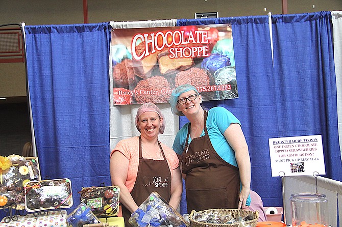 Mandy Sidwell and Carolanne Leavitt from the Chocolate Shoppe gave attendees chocolate samples during the Business Showcase Thursday.