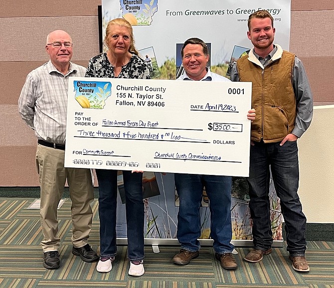 The Churchill County Commission presents a check for $3,500 for the annual Fallon Armed Forces Day. From left are Commission Chairman Bus Scharmann, Armed Forces Day organizer Essie Burriss, and Commissioners Justin Heath and Myles Getto.