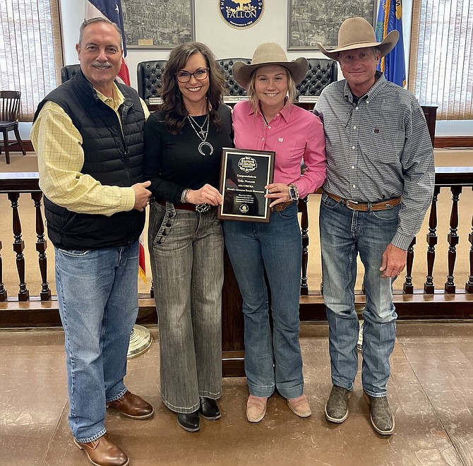 Mayor Ken Tedford is shown with the Norcutt family. From left Cari, Tylie and Darrel.