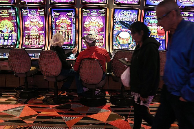Gamblers play video slots in a newly-remodeled gaming space at the Fremont Hotel-Casino on Jan. 12, 2023.