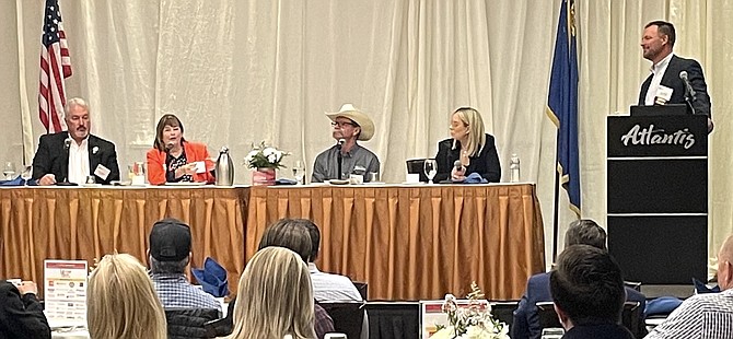 Sparks Mayor Ed Lawson, left, Carson City Mayor Lori Bagwell, Fernley Mayor Neal McIntyre and Reno Mayor Hillary Schieve on Tuesday at the Atlantis Casino Resort Spa. The discussion was moderated by Cory Miller, sales manager of Stewart Title National Commercial Services, right.