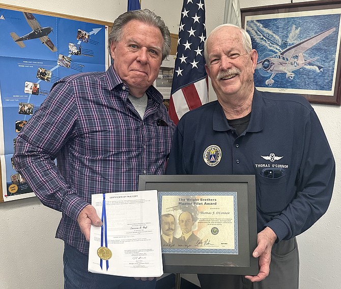 Larry Dale Cheek of the FAA’s Reno Flight Standard District Office presents Tom O’Connor of the Douglas County Composite Squadron, Nevada Wing, Civil Air Patrol with the Wright Brothers Master Pilot Award. Photo by Eric Bero