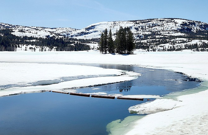 The dam at Silver Lake is starting to show some open water in the high Sierra as warm temperatures continue to melt the ice. Photo special to The R-C by Denny Redford