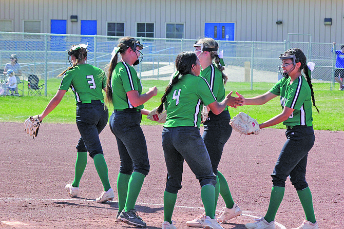 The Greenwave softball team celebrates after recording an out in its series at Lowry, where Fallon swept the Buckaroos to clinch the 3A East title.