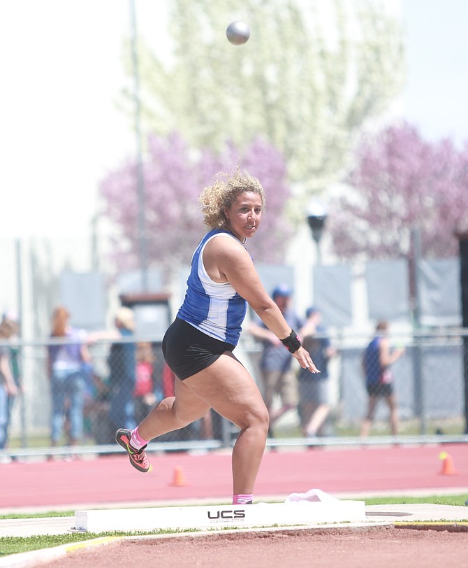 Carson High’s Anela Mitchell watches her shot put at the Big George Invitational on Saturday. Mitchell was fifth in the shot put and second in the discus at the last meet of the regular season.