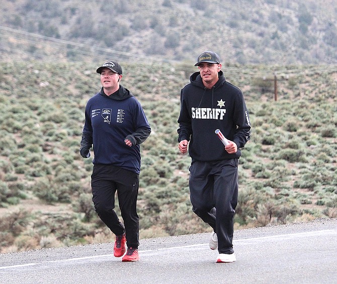 Deputies Robert Oakes and Thomas Martinez ran seven miles bringing the baton into Douglas County on Wednesday morning as part of the Law Enforcement Memorial Run.