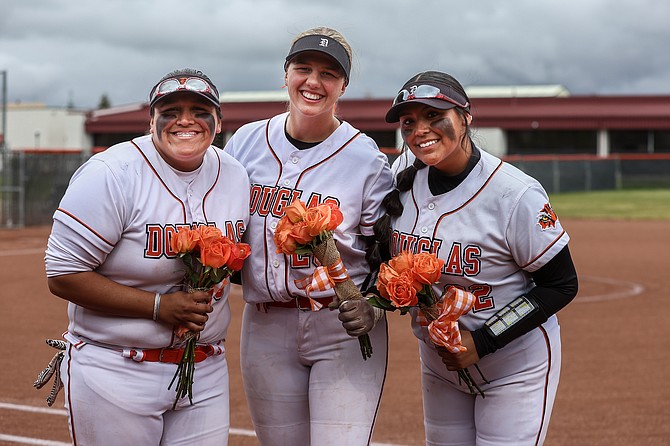 The three seniors of Douglas High softball pose for a photo after besting McQueen on Tuesday in Minden. Pictured from left to right are Dakota Till, Mackenzie Willis and Bre Williams.