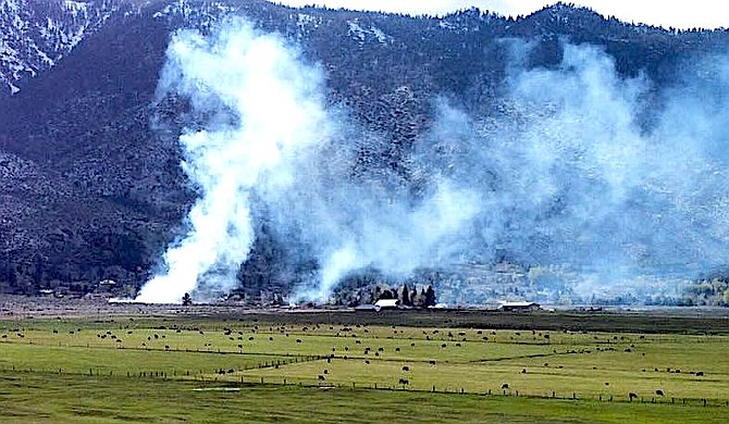 Smoke rises from a wildfire near the base of Kingsbury Grade on Sunday. Photo special to The R-C by Dave Benjamin