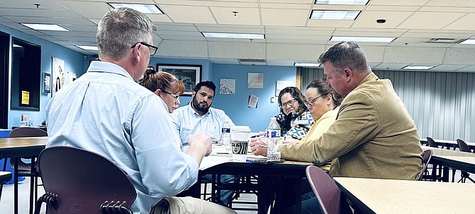 Carson City School District spokesman Dan Davis, right, leads a group of administrators in a discussion about the district’s strategies and success standards during the May 3 Professional Learning Community meeting in the Carson High School library.