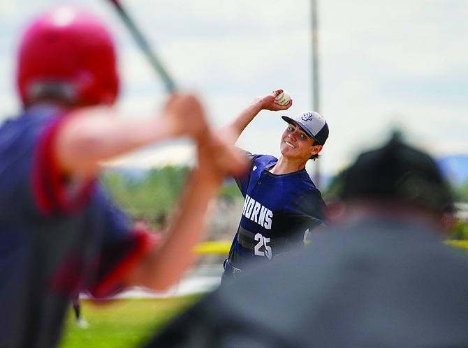 Oasis Academy’s Fenn Mackedon pitches against Pershing County on Friday.