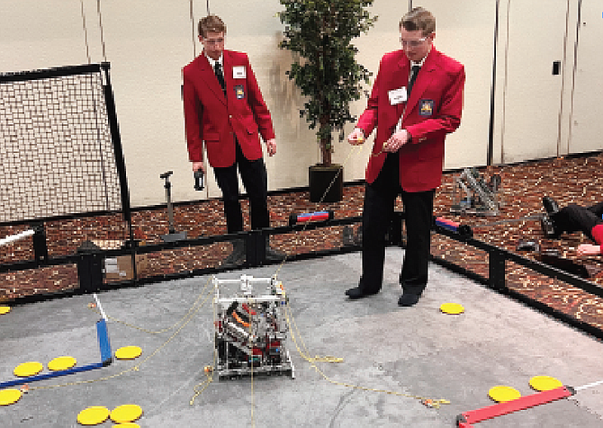 Lowry Career and Technical Education students Caleb Hales (left) and Tanner Hatch (right),  both are sophomores, competed in the Mobile Robotics competition during the SkillsUSA Conference in April.