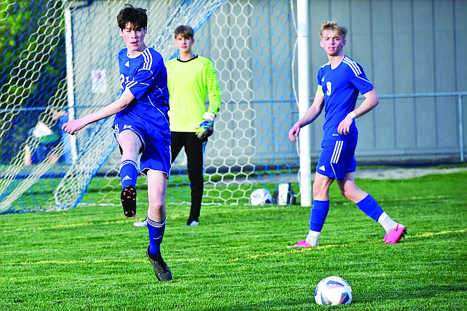 Eatonville players Jake Brannon (left), Nathaniel Goode (center) and Trentten Cressman (right) played tough defense in their match last week against King's Way.