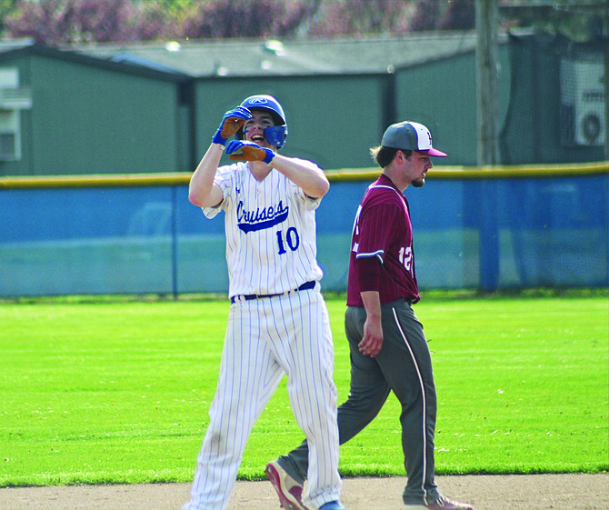Eatonville's Joe Suver looks towards the Cruisers' dugout after he got the scoring started with an RBI single in the second inning.