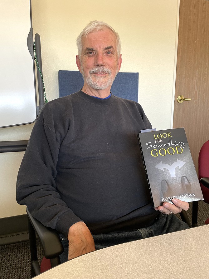 Robert Drews in the Nevada Appeal office with his new book May 9.