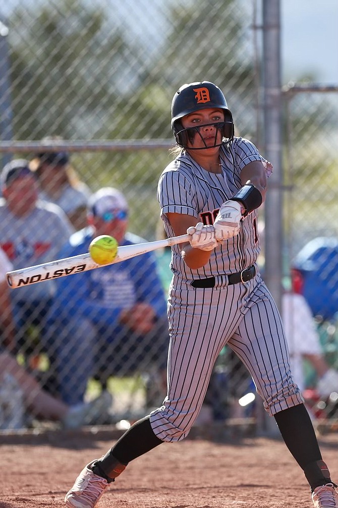 Zora Simpson turns on her ninth home run of the year and Douglas’ 60th home run as a team. Simpson and the Tigers tied an NIAA state record for home runs in a season with the long ball, matching 2017 Palo Verde, which homered 60 times in 43 games. Douglas is 29-4 and will play for the regional crown Saturday at noon.