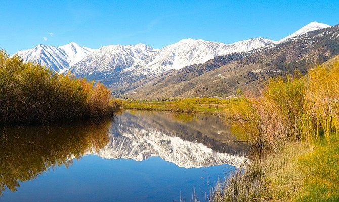 The Carson Range is reflected in the West Fork of the Carson River on Thursday. Photo special to The R-C by John Zanteson.