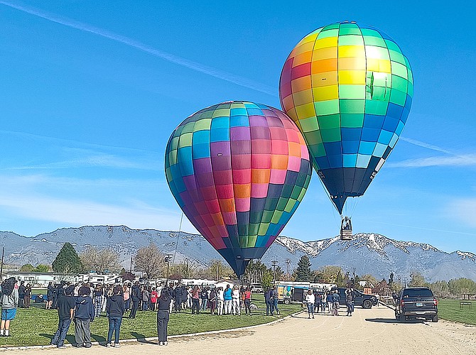Hot air balloons land on the Carson Valley Middle School track field as part of the Hot Air for Hope School Outreach program where students learned the mechanics of hot air balloons.