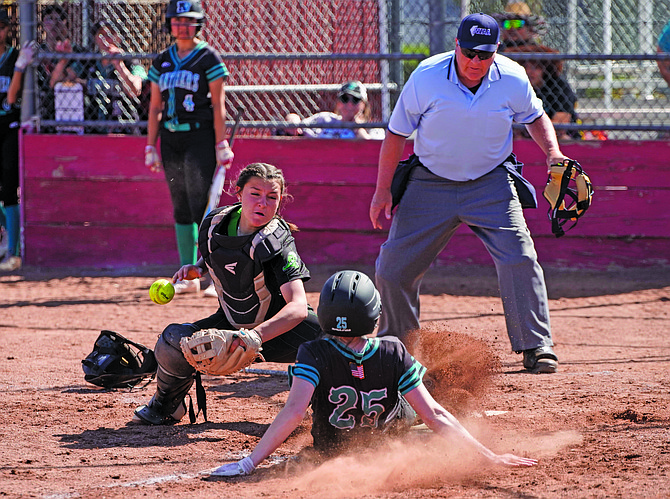 The ball pops out as Fallon catcher Taralynn Vershum tries to tag North Valleys’ Kelsee Grow at the plate in the fifth inning when the Panthers came back to tie the game in Fallon’s 5-4 loss on Saturday in Reno.