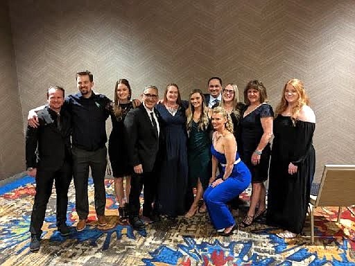 From left to right: Leo Frediani, Hunter Dietmeier, Claire Carlson, Eddie Rivera, Amber Price, Alannah Bradley, Ernest Osborn, Kristy Fauria, Teresa Hendricks, Linda Torgerson and Annie Angulo at an awards dinner May 12.