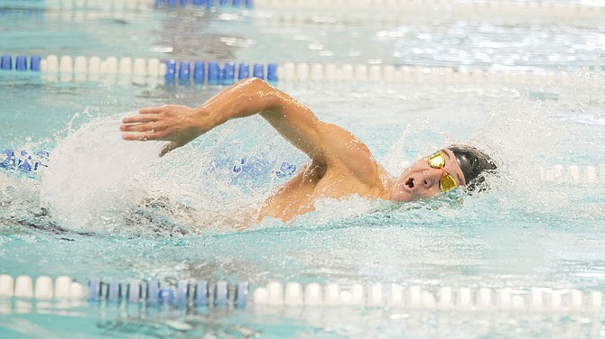 Douglas High senior Calvin Stevenson competes in the 200-yard freestyle in Friday's Northern Region Swimming Trials at the Carson Aquatic Center. Stevenson won the event and will advance to the state meet Saturday, May 20 at Carson Aquatic Center.