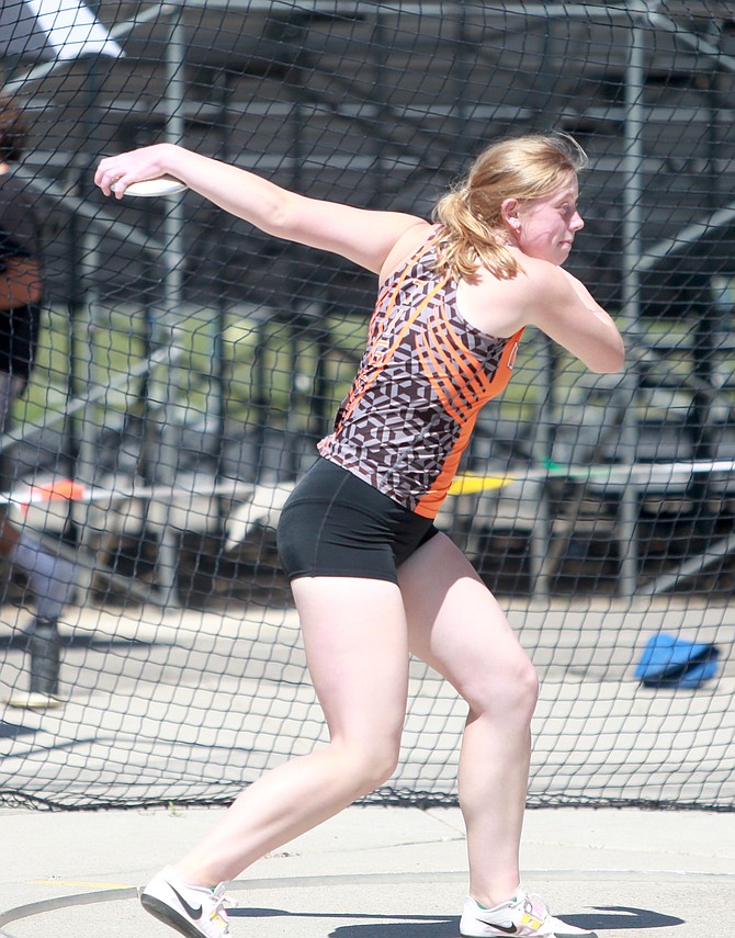 Douglas High senior Sophie Marchut winds up to fling the discus, during the Class 5A North regional track and field meet Saturday at Reed High. Marchut won the regional title in the shot put with a throw of 35 feet, six-and-a-half inches.