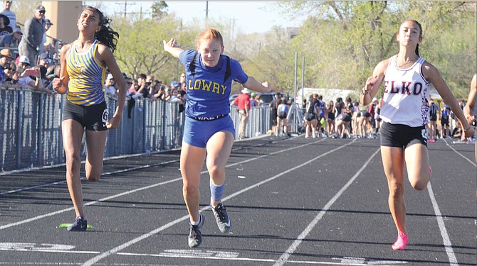 Lowry's Sydnee Pettis hits the finish line in the 10-meter dash on Friday night at the Northern 3A Regional Championships at Reed High School.