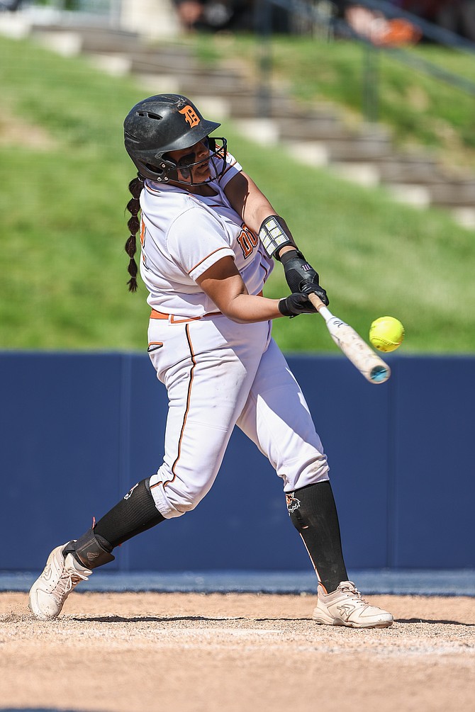 Douglas High senior Bre Williams connects with her ninth home run of the season for the Tigers, coming in the first round of the Class 5A state tournament against Palo Verde. Williams gave Douglas a 7-0 lead with her dinger to left in the fifth inning.