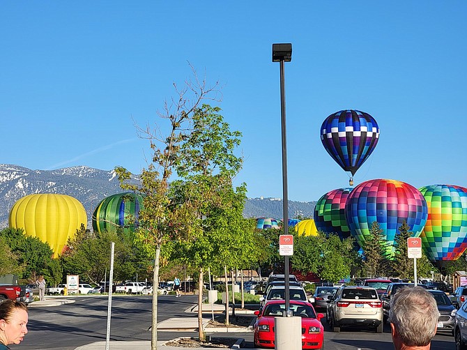 Balloons launch at Lampe Park on Friday morning in this photo by John Hefner.