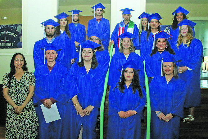 Graduates from the 2023 Churchill County Adult Education program prepare to receive their diploma at last week’s graduation. Chantelle Redner, director of the adult diploma program, is standing lower left.