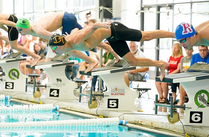 Douglas High senior Calvin Stevenson leaps off the blocks to begin the 200-yard freestyle event at the 5A state championship meet at Carson Aquatic Center. Stevenson was third in the event in 1:42.34 and was the quickest of any swimmer from the North.