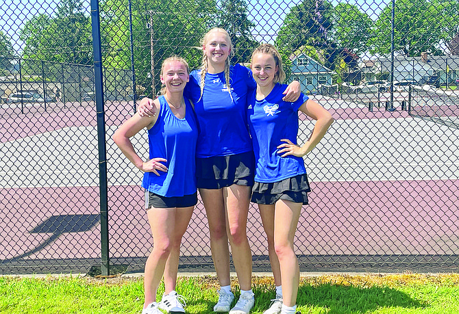Eatonville’s Bailey Andersen, Lillian Bickford and Alayna Meyer pose for a photo during the 1A SWW District 4 tournament.