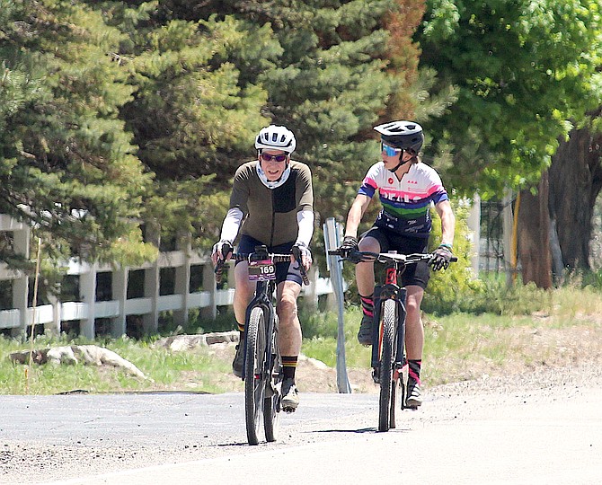Cyclists ride up Genoa Lane on Saturday for an event that took them south on Highway 395 west on Genoa Lane and back up Jacks Valley Road. Be watchful for cyclists, runners and pedestrians along the highways.