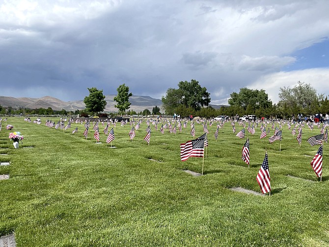 American flags line veteran graves at Lone Mountain Cemetery in Carson City on Friday.