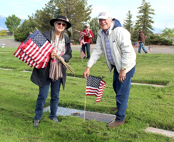 Tahoe Douglas Elks Kathleen Swartz and Bill Iverson place flags on the graves of veterans on Friday in honor of Memorial Day.