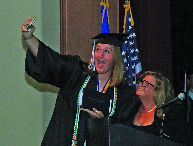 Stacie Bogdanowicz takes a selfie with Rochelle Tisdale, Oasis Academy College Prep’s chief academic officer, at last week’s graduation.