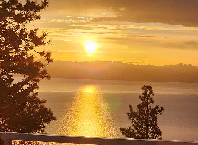 The sunset over Lake Tahoe takes a golden hue after thunderstorms on Tuesday. Photo special to The R-C by June Shafer