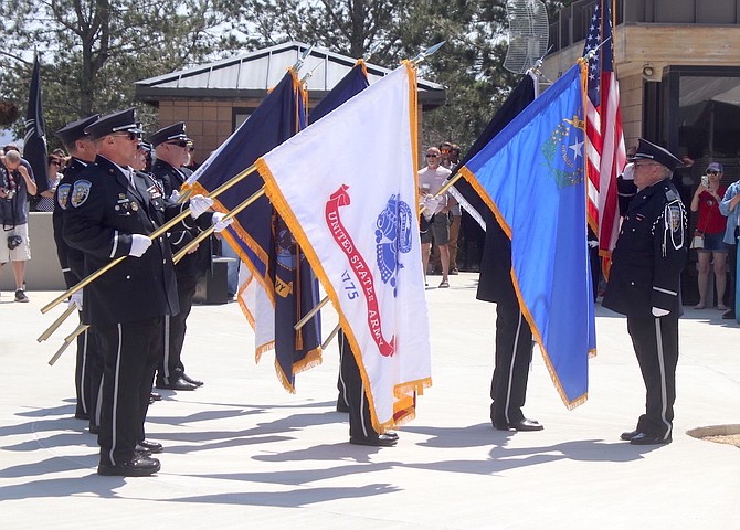 The Nevada Veterans Coalition honor guard begins to moves to an upright position after the national anthem. The NVC participates annually in the Memorial Day services at the Northern Nevada Veterans Memorial Cemetery in Fernley.