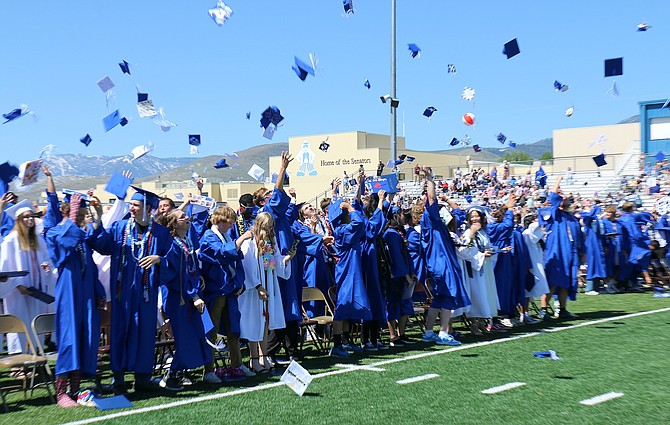Jessica Garcia / Nevada Appeal
Graduates of Carson High School’s Class of 2023 toss their caps in celebration at the end of the ceremony.