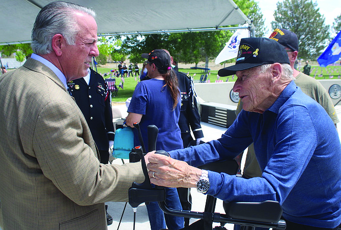 After the Memorial Day services at the Northern Nevada Veterans Memorial Cemetery in Fernley, Gov. Joe Lombardo, left, talks with Korean War veteran Don Erickson.
