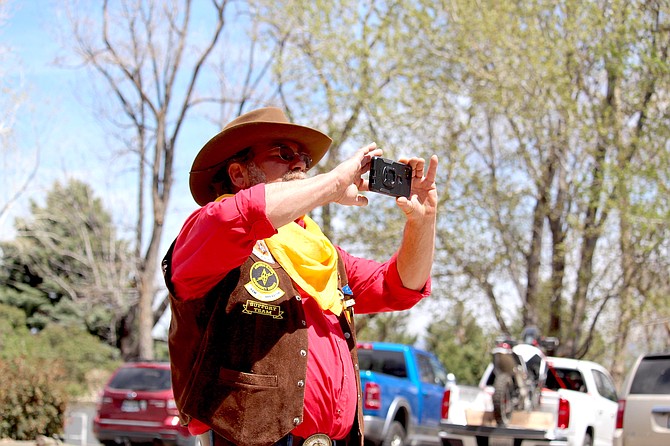 A member of the Pony Express re-ride support team takes a picture at the Genoa Western Heritage Days in May.