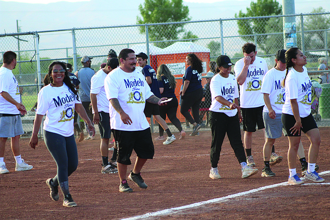 Modelo Time walks off the field after a successful game last summer.