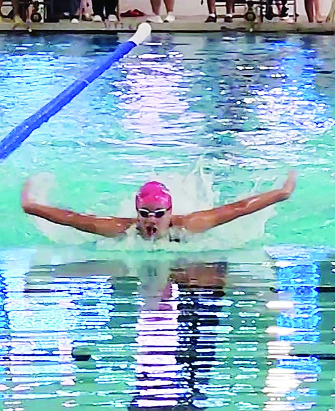 Battle Mountain's Nevaeh Serna swims the 100-meter butterfly at the 2023 Intermountain Classic in Carson City.