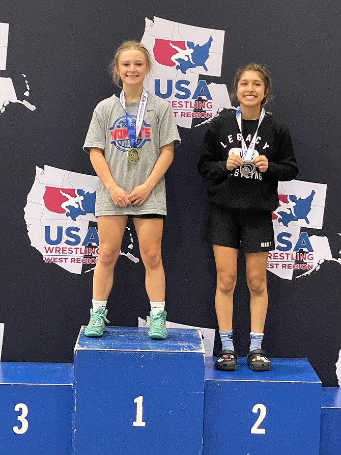 Ella Kavanagh, left, stands at the top of the podium after going undefeated in the 2023 Western Regional Championship in both freestyle and Greco competitions.