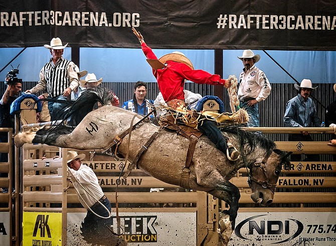 A contestant competes in the saddle bronc competition at the inaugural Battle Born Broncs event at Rafter 3C Arena in Fallon.