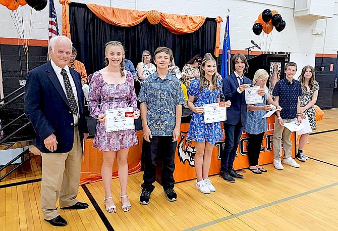 Carson Valley Middle School students received gift cards from Tahoe-Douglas Elks Lodge Education Chairman Bob Haug, left. Students of the Month and Student of the Year Morgan Gooch.