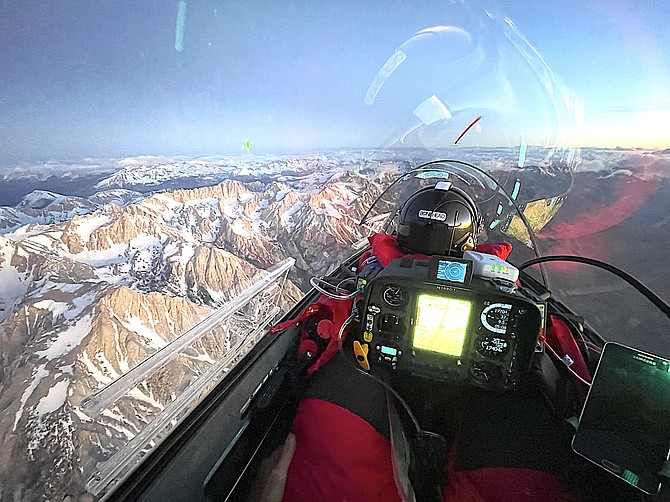 Bruce Campbell in the front seat looks north over the Owens Valley at sunrise on Monday as the glider approaches Mount Whitney on the left.