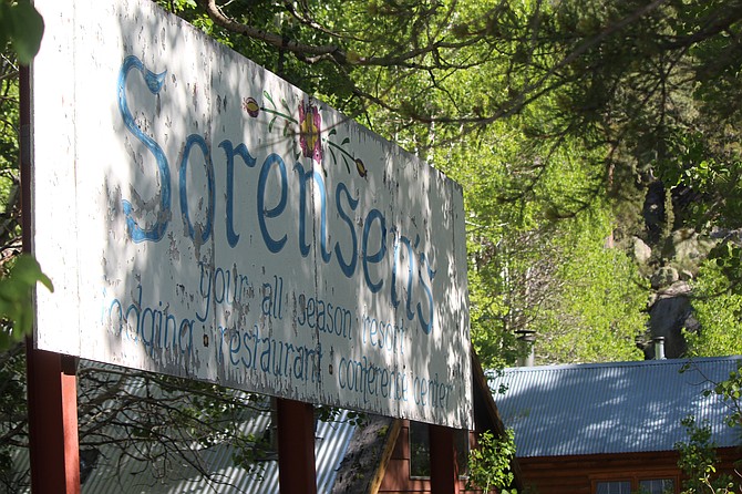 The old Sorensen’s sign lurks in the forest in 2020 after the resort was renamed Wylder Hotel Hope Valley. On June 18, owners announced the new name would be Desolation Hotel Hope Valley.