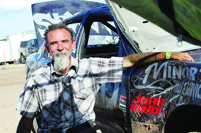 John Flowers stands by his race car, a bootlegger.