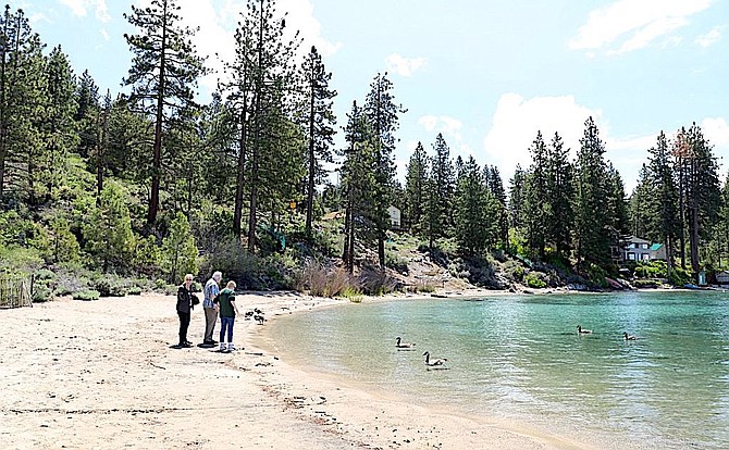 People on the beach in mid-June at Cave Rock. They’re going to have a lot of company this Fourth of July weekend.
Hannah Pence/Tahoe Daily Tribune
