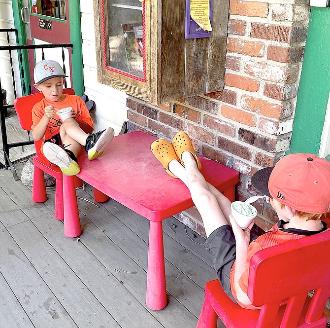 Hudson Tholen and Beau Gannon enjoy some ice cream at the Genoa Country Store in this photo by Hudson's grandad Roger Falcke.
